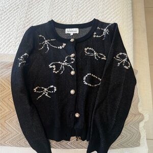 Heartloom Black Cardigan with White Bow Design